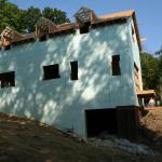 Side view; dormers being framed on roof